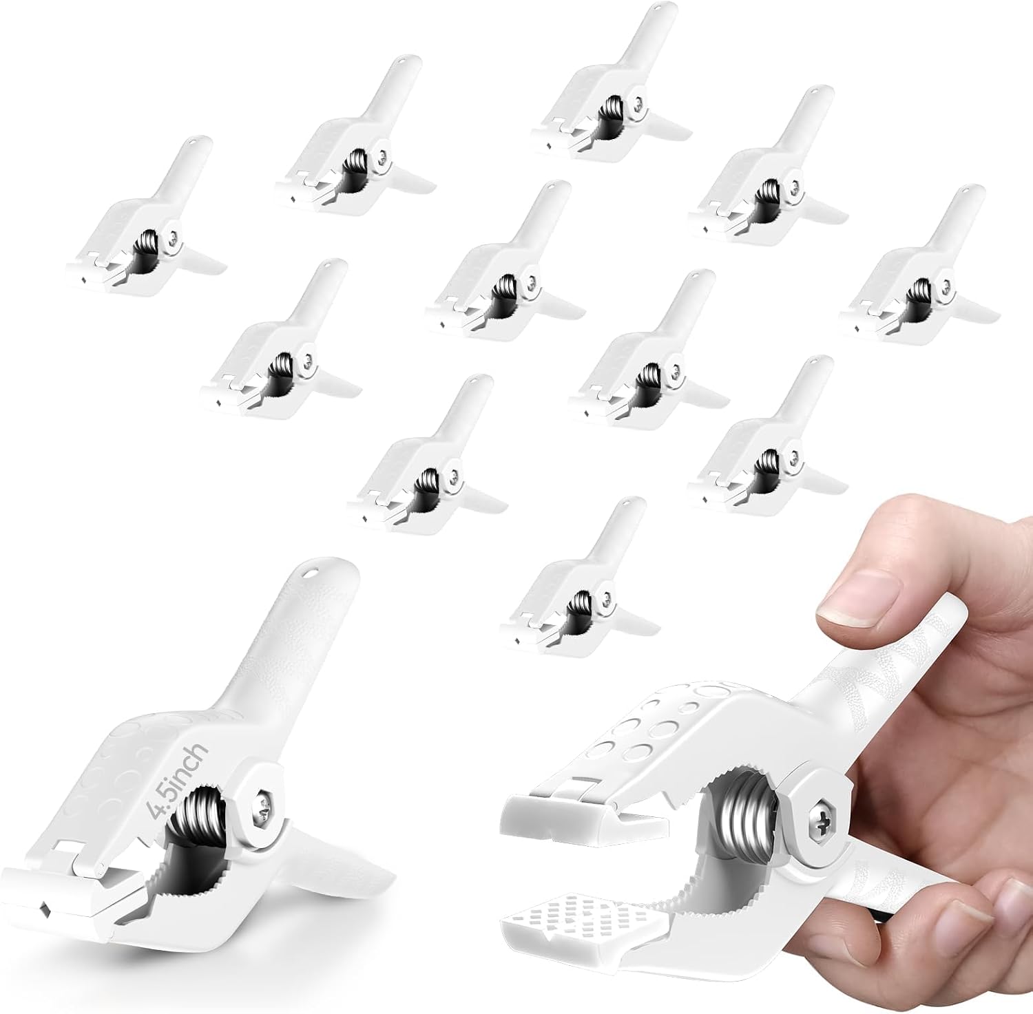 White plastic backdrop clips with a spring mechanism, each measuring 4.5 inches, designed for heavy-duty use.