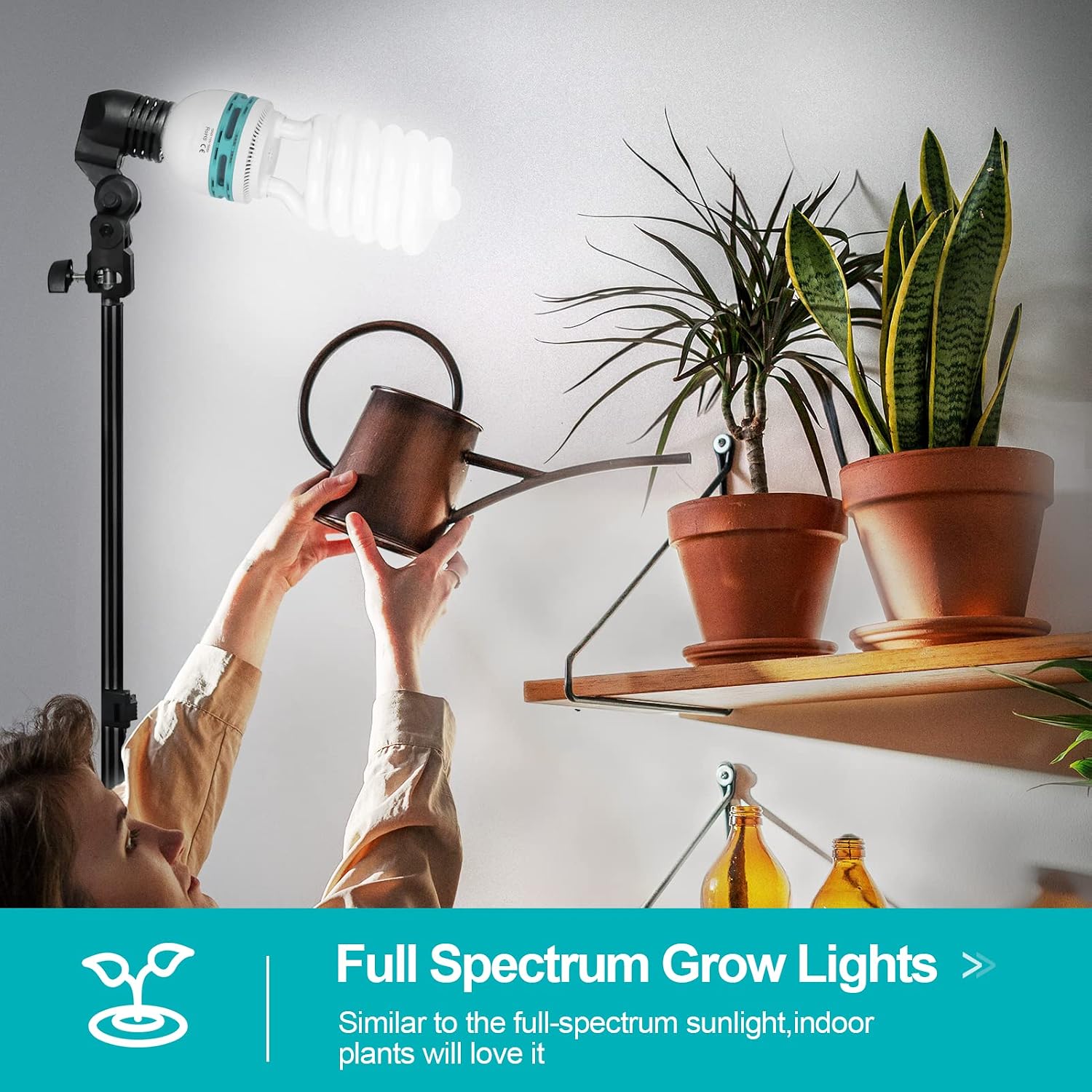 EMART spiral CFL bulb mounted on a stand beside potted indoor plants and a person holding a watering can.